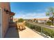 Private balcony offering seating with views of the community and distant mountains on a clear day at 2434 Amoretti St, Henderson, NV 89052
