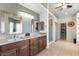 Bathroom with dual vanities, a walk-in shower, and neutral color palette at 2434 Amoretti St, Henderson, NV 89052