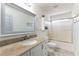 Clean bathroom with granite countertop vanity and glass-enclosed shower at 2434 Amoretti St, Henderson, NV 89052