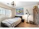 Comfortable bedroom with a ceiling fan and a bright window with a view at 2434 Amoretti St, Henderson, NV 89052