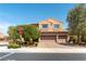 Charming two-story home with a three-car garage, manicured landscaping, and welcoming curb appeal at 2434 Amoretti St, Henderson, NV 89052