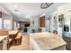 Open concept kitchen leading to dining and living areas, wood floors, and lots of light at 2434 Amoretti St, Henderson, NV 89052