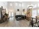 Bright living room with high ceilings, wooden floors, modern decor, and ample natural light at 2434 Amoretti St, Henderson, NV 89052