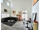 Open living room featuring high ceilings, hardwood style floors, modern decor, and ample natural light at 2434 Amoretti St, Henderson, NV 89052