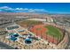 Aerial view of community sports fields, baseball diamonds, and playground, set against mountain backdrop at 2579 Speyburn Ave, Henderson, NV 89044