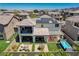 Spacious backyard offering multiple seating areas, a covered patio, and a pristine pool with a view at 2579 Speyburn Ave, Henderson, NV 89044