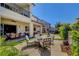 Expansive backyard with multiple seating areas, a hot tub, and a covered patio, perfect for entertaining guests at 2579 Speyburn Ave, Henderson, NV 89044
