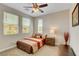 This bedroom has a ceiling fan and window shades at 2579 Speyburn Ave, Henderson, NV 89044