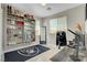 A home office with a built-in bookshelf and a Raiders rug at 2579 Speyburn Ave, Henderson, NV 89044