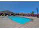 Community pool featuring clear blue water, stylish patio furniture, and well-maintained landscaping at 2579 Speyburn Ave, Henderson, NV 89044