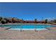 A beautiful community pool with clean, inviting water surrounded by paved decking and lounge seating at 2579 Speyburn Ave, Henderson, NV 89044