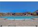 Sparkling community pool with handrails, surrounded by a brick patio, lounge chairs, and inviting atmosphere at 2579 Speyburn Ave, Henderson, NV 89044