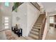 Grand entryway with high ceilings, a staircase, and a console table, creating a welcoming atmosphere at 2579 Speyburn Ave, Henderson, NV 89044