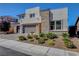Charming exterior view of a two-story home showcasing desert landscaping and modern architecture at 2579 Speyburn Ave, Henderson, NV 89044