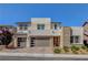 Stunning two-story home with a three-car garage and manicured front yard at 2579 Speyburn Ave, Henderson, NV 89044