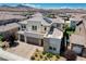 Beautiful two-story home with a well-maintained front yard, paved driveway, and stone accents at 2579 Speyburn Ave, Henderson, NV 89044
