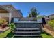 Backyard with a hot tub, complemented by artificial grass, creating a private and relaxing oasis at 2579 Speyburn Ave, Henderson, NV 89044