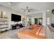 Open living room features a large sectional sofa, decorative shelving, and a ceiling fan at 2579 Speyburn Ave, Henderson, NV 89044