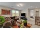 Spacious loft with a comfortable sofa, TV, and large windows offering plenty of natural light at 2579 Speyburn Ave, Henderson, NV 89044