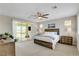 This main bedroom has a king bed, ceiling fan, and balcony access at 2579 Speyburn Ave, Henderson, NV 89044