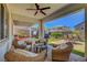 Relaxing covered patio featuring comfortable wicker seating, ideal for enjoying outdoor living at 2579 Speyburn Ave, Henderson, NV 89044