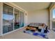 Inviting patio features comfortable seating, a stylish rug, and sliding glass doors for indoor-outdoor living at 2579 Speyburn Ave, Henderson, NV 89044