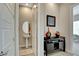 Stylish powder room featuring a pedestal sink, decorative mirror, and elegant accents at 2579 Speyburn Ave, Henderson, NV 89044