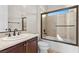 Bathroom featuring a double sink and shower/tub combo with glass doors at 2717 Mona Lisa St, Henderson, NV 89044