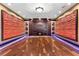 Large bonus room with statement wall decor, fireplace, recessed lights, and hardwood floors at 2717 Mona Lisa St, Henderson, NV 89044