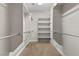Walk-in closet is equipped with built-in shelving and hanging racks at 2717 Mona Lisa St, Henderson, NV 89044