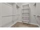 Walk-in closet is equipped with built-in shelving and hanging racks at 2717 Mona Lisa St, Henderson, NV 89044