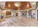 Spacious room featuring wood floors, recessed lighting, paneled ceilings, and a mirrored wall at 2717 Mona Lisa St, Henderson, NV 89044