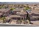 Elegant two-story home with a tile roof, porte-cochere, desert landscaping, and a well-manicured front yard at 2717 Mona Lisa St, Henderson, NV 89044