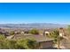 Panoramic mountain views surround beautiful homes with red tile roofs and desert landscaping at 2717 Mona Lisa St, Henderson, NV 89044
