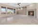 Inviting living room features ample windows, stone floors, recessed lighting, and a stone fireplace at 2717 Mona Lisa St, Henderson, NV 89044