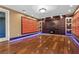 Modern media room with a textured wall, custom built-ins, and recessed lighting at 2717 Mona Lisa St, Henderson, NV 89044