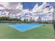 Well-maintained tennis courts surrounded by lush landscaping, street lights, and benches at 2717 Mona Lisa St, Henderson, NV 89044