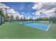 Well-maintained tennis courts surrounded by lush landscaping, street lights, and benches at 2717 Mona Lisa St, Henderson, NV 89044