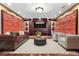 A media room with custom wall paneling, dark wood accents, and comfortable seating arrangement at 2717 Mona Lisa St, Henderson, NV 89044
