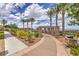 Paved walking path with stone pergola and mature landscaping at 2717 Mona Lisa St, Henderson, NV 89044