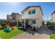 Private backyard with a patio, play area, and manicured landscaping at 2928 Sunday Silence Rd, North Las Vegas, NV 89086