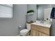 Powder room featuring a modern sink vanity and neutral color scheme at 2928 Sunday Silence Rd, North Las Vegas, NV 89086