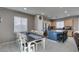 Dining room with view of kitchen island, stainless appliances, and eat-in bar at 2928 Sunday Silence Rd, North Las Vegas, NV 89086