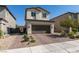 Inviting two-story home featuring a brick driveway and a convenient two-car garage at 2928 Sunday Silence Rd, North Las Vegas, NV 89086