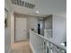 Upstairs hallway with white railings and views of the downstairs area at 2928 Sunday Silence Rd, North Las Vegas, NV 89086