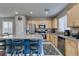 Kitchen featuring granite island, stainless steel appliances, and breakfast bar at 2928 Sunday Silence Rd, North Las Vegas, NV 89086