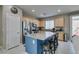 Kitchen with granite island and stainless steel refrigerator, with backyard view at 2928 Sunday Silence Rd, North Las Vegas, NV 89086