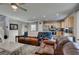 Spacious living room with open floor plan, adjoining the kitchen and dining area at 2928 Sunday Silence Rd, North Las Vegas, NV 89086