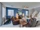 Modern living room with dark blue accent wall and light tile flooring at 2928 Sunday Silence Rd, North Las Vegas, NV 89086