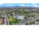 Aerial view showcasing a school with playfields surrounded by residential neighborhoods at 3065 S Torrey Pines Dr, Las Vegas, NV 89146